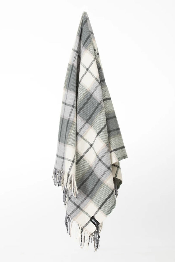 Palliser Ridge Twill Check lambswool throw in Forest, hanging to show the full check pattern