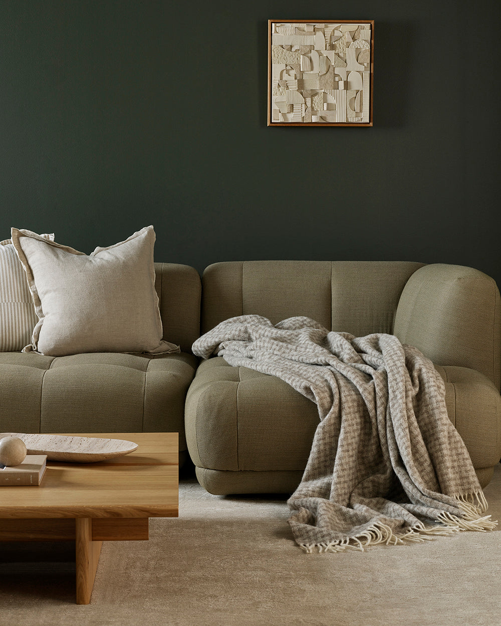 Cozy living room with a beige sofa and neutral patterned wool large throw 