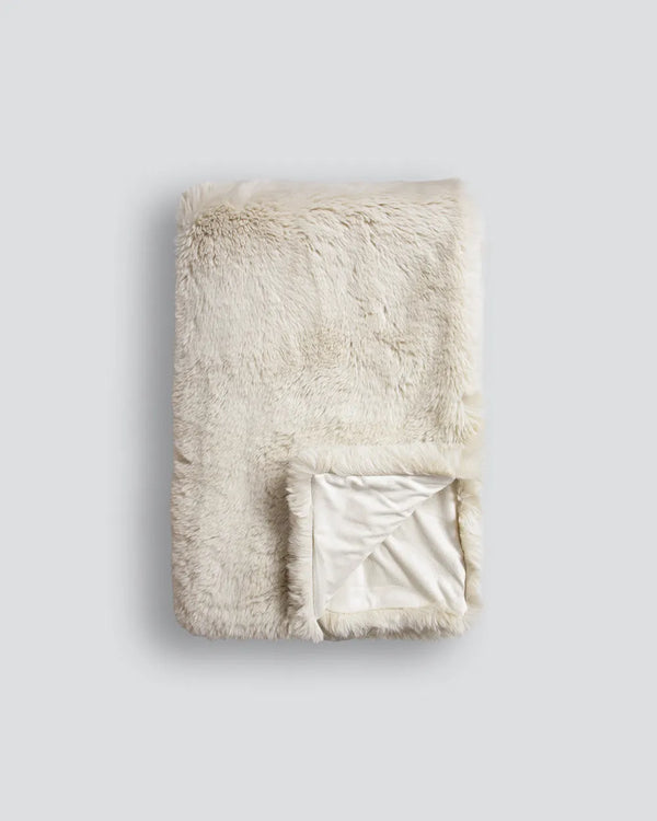 Soft, 'Pele' faux fur throw blanket, folded showing reverse folded up, by Baya