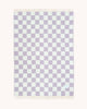 A full view of the reversible wool throw blanket in Checkerboard Lilac White by Maison Deux