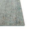 Close up of the corner of a viscose blend statement rug in shades of muted ocean blue, by Globe West and Soren Liv NZ.