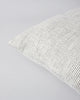 Close up of the Baya Sandridge cushion in creamy white with a fine pin stripe