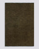 A full image of the Baya Sandringham floor rug in Moss, a deep, warm, green shade, made with fringed edges in 100% wool. 