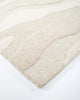 Corner of the 'Shoreline' wool rug, by Baya, showing textural cut and loop pile design