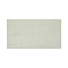 Full view of a handmade, 100% wool floor rug by Soren Liv NZ and Globe West, in subtle shades of light blue and green, shades of seafoam. The edges of the rug are indented, lending subtle sophistication.