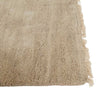  Corner of a soft handloomed rug in a soft beige Pumice colour by Soren Liv. The edges are lightly fringed