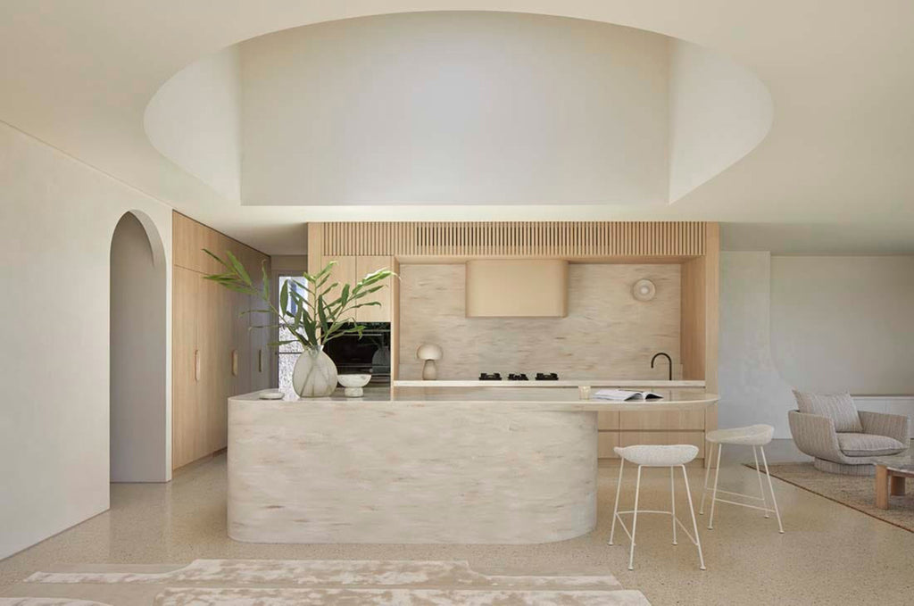 A cream, light natural beige floor rug with geometric designs rendered in alternating pile heights, by Globe West and Soren Liv NZ, situated in a modern kitchen.