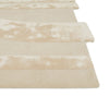 Corner view of a cream, light natural beige floor rug with geometric designs rendered in alternating pile heights, by Globe West and Soren Liv NZ.