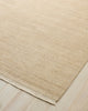 Weave Home Anton wool rug in Sand on a pale timber floor