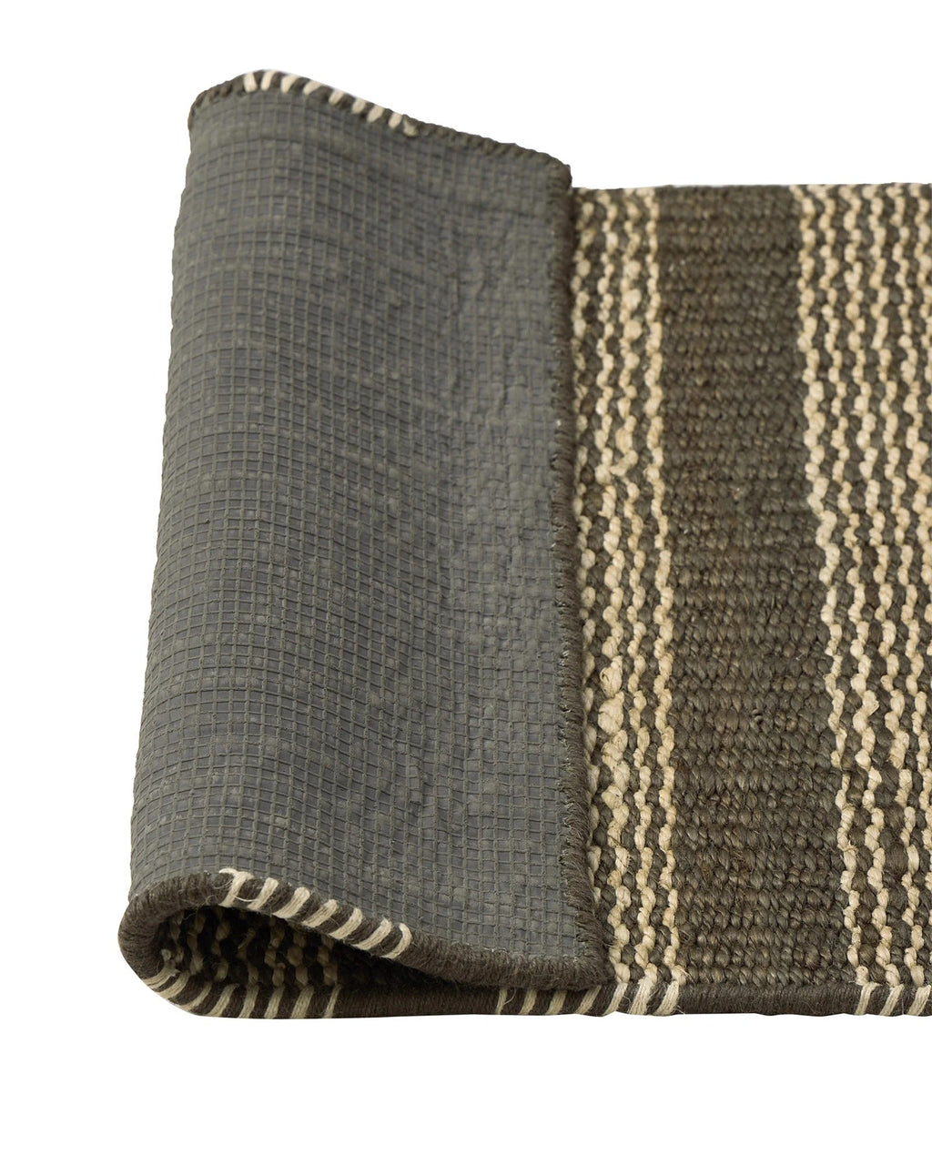 Corner of the Weave Home Arden jute doormat in Coal folded back to show the grey non-slip backing.