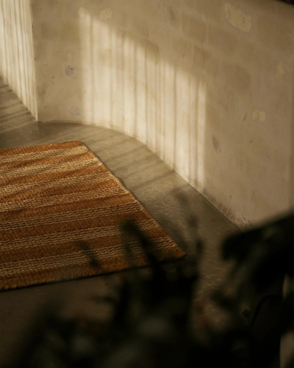 Weave Home Arden Jute Doormat in Natural placed at an entryway