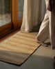 Weave Home Arden Jute Doormat in Natural styled in a living space with linen curtains