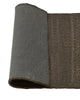 Weave Home Ivano jute doormat in Graphite, folded to show the non-slip rubber backing.