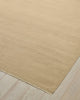 Weave Home Jacqueline wool rug in Barley, close-up of the flatweave texture and fringe on a timber floor.