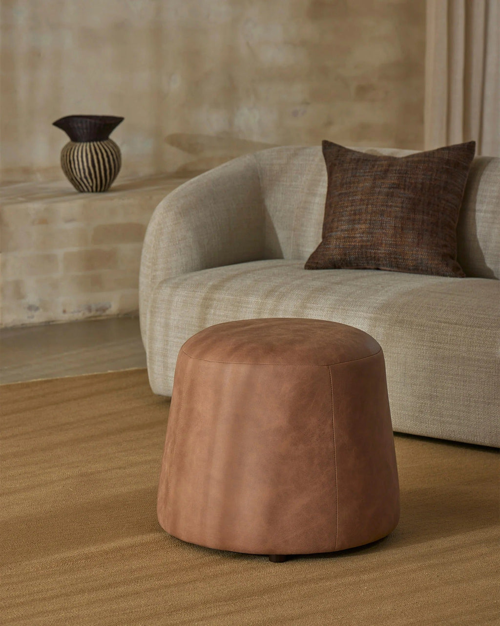 Weave Home Jacqueline wool rug in Brulee, shown underfoot in a styled living room setting.