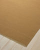 Weave Home Jacqueline wool rug in Brulee, close-up of the flatweave texture and fringe on a timber floor.