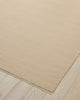 Weave Home Jacqueline wool rug in Cashew on a pale timber floor, showing the fringed corner