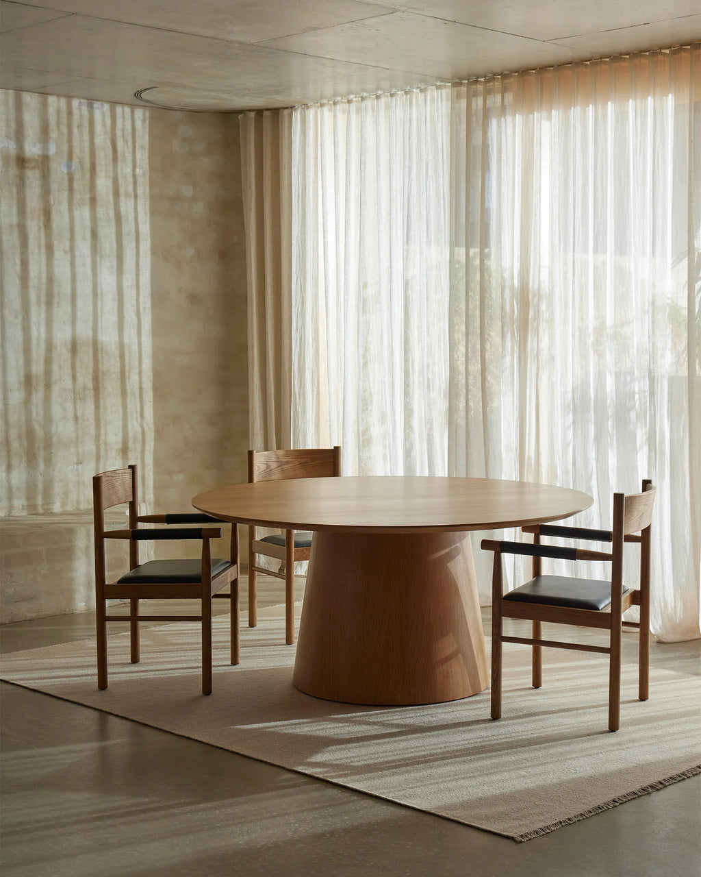 Weave Home Jacqueline wool rug in Cashew under a round timber dining table with four chairs