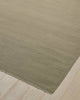 Weave Home Jacqueline wool rug in Pumice on a pale timber floor, showing the fringed corner