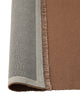 Weave Home Jacqueline wool rug in Rosewood folded back to show the backing and fringe