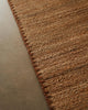 Weave Home Monroe jute rug in Biscuit, close view of the handwoven jute and blanket stitch border
