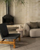 Weave Home Monroe jute rug in Flint with a black leather chair and a linen sofa