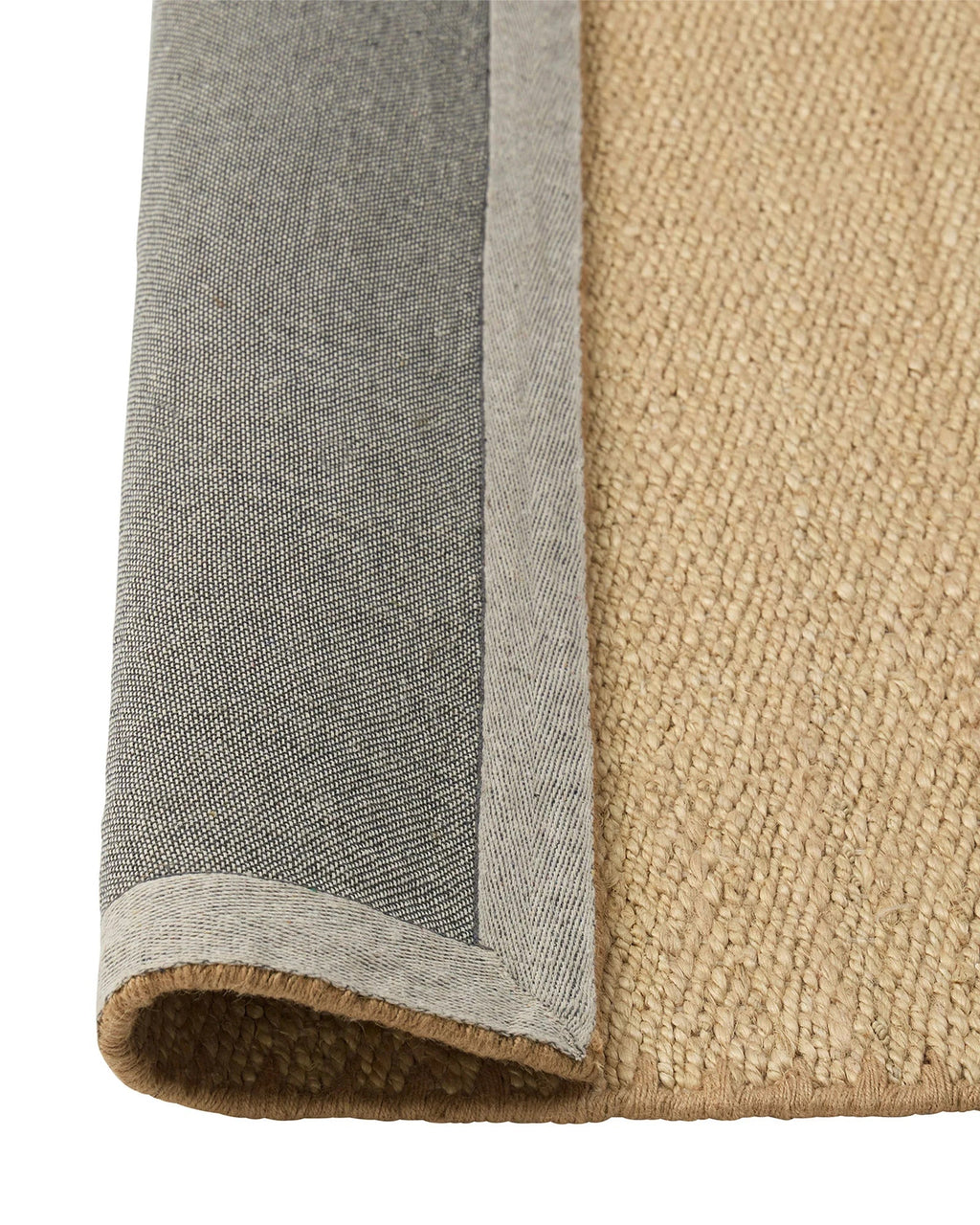 Weave Home Monroe jute rug in Oat folded back to show the cotton backing
