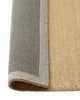 Weave Home Monroe jute rug in Oat folded back to show the cotton backing