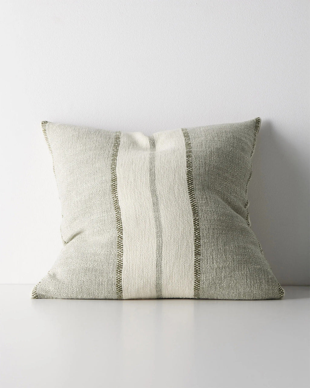 Weave Home Ottavio cushion in Lagoon on a plain background.