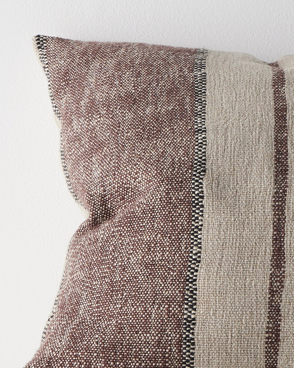 Close-up of the woven stripe texture on the Weave Home Ottavio cushion in Mulberry.
