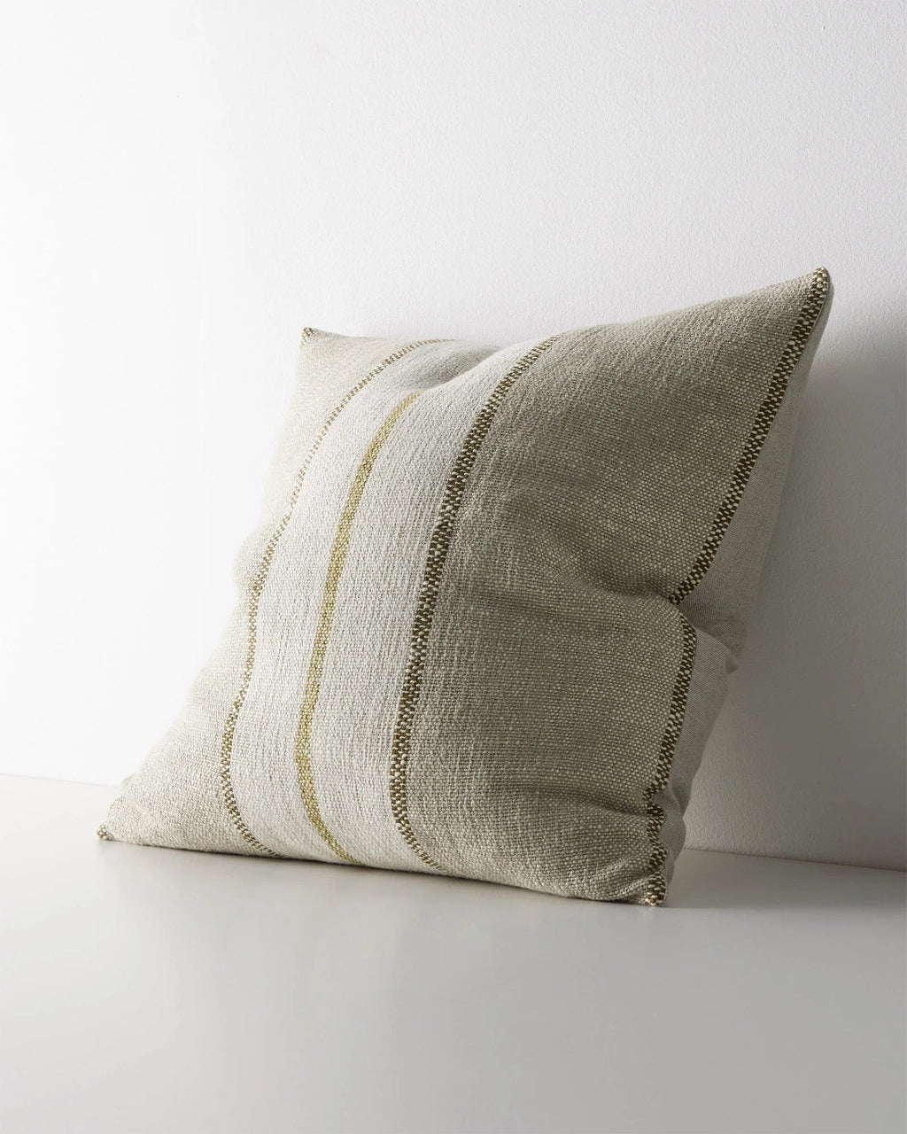 Weave Home Ottavio cushion in Willow, shown from an angle on a plain background.