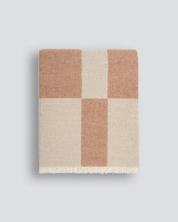 Baya check throw blanket in soft beige and coral colours