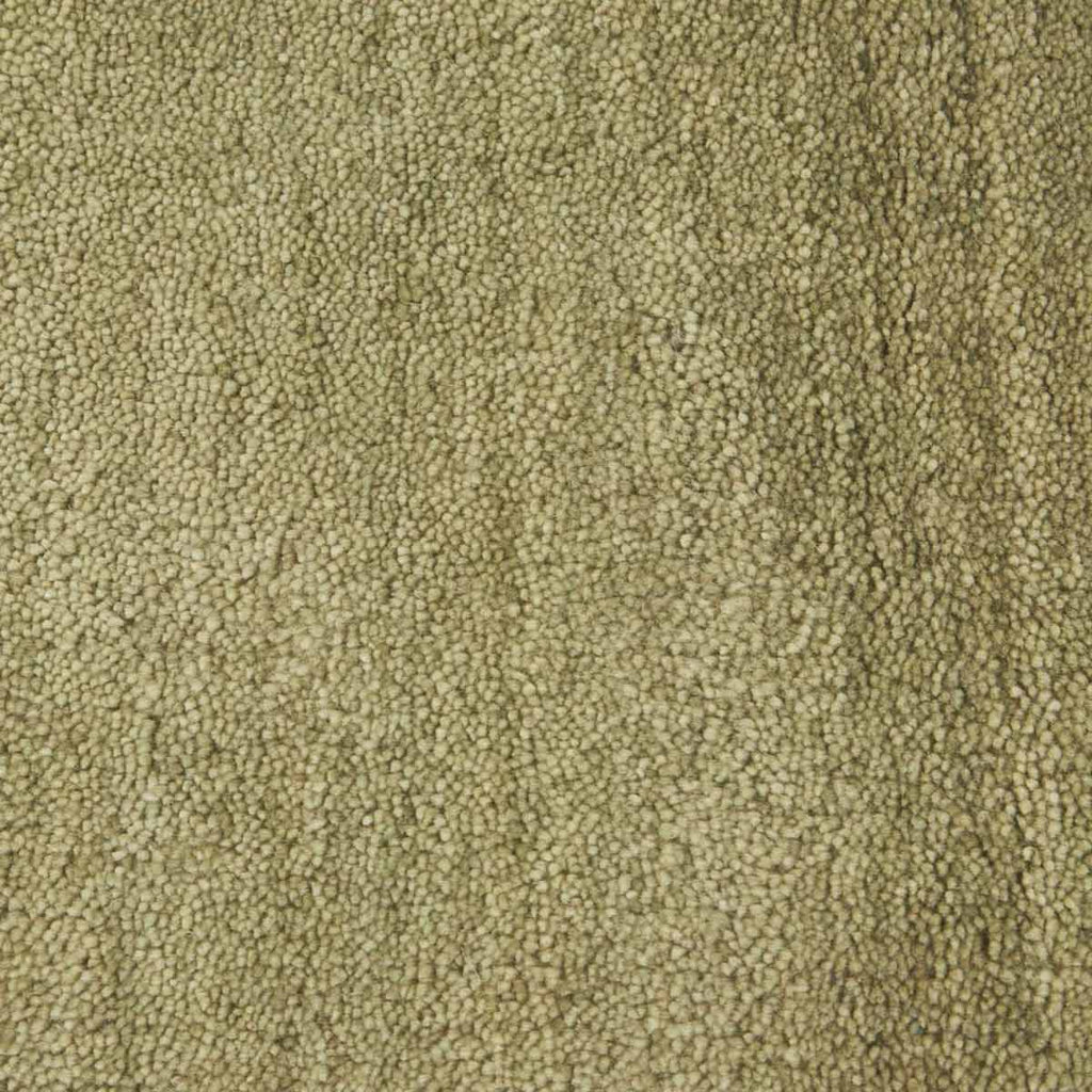 Close up of a green rug, handmade with NZ wool by Soren Liv