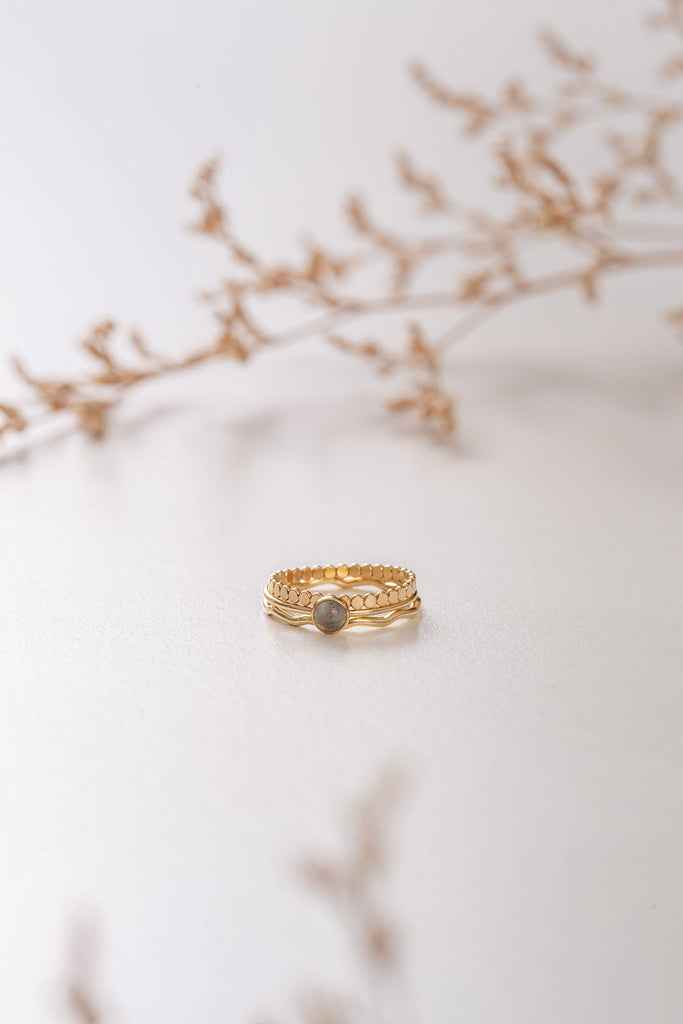 The Cambodia three-ring stack by Zoaje, made with yellow gold-fill rings and natural labradorite
