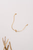 A fuller view of the Thailand bracelet made with 14k gold-fill hammered chain and displaying an elegant OT fastening. 