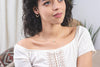 A woman wearing Zoaje Italy earrings. 