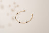 A full picture of the black agate and yellow gold Rouen bracelet. 
