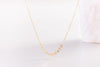 A view of the Italy necklace by Zoaje, in yellow gold fill with ten beautiful charms along a delicate chain. 