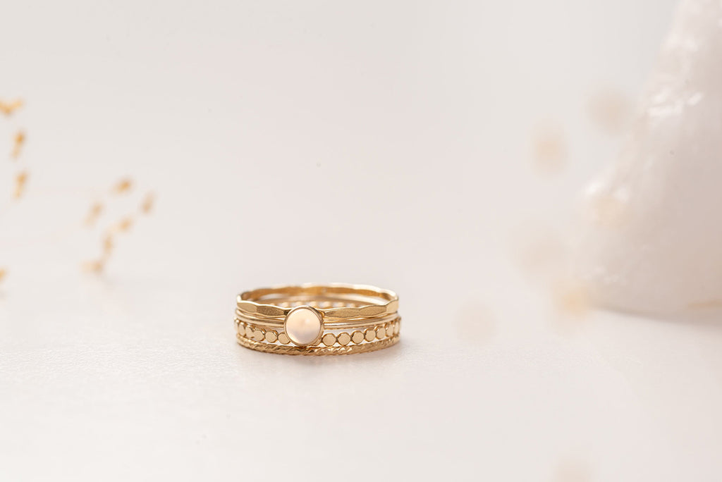 The Malaysia ring stack by Zoaje, with hammered gold-fill and a feature stone of natural white agate. 
