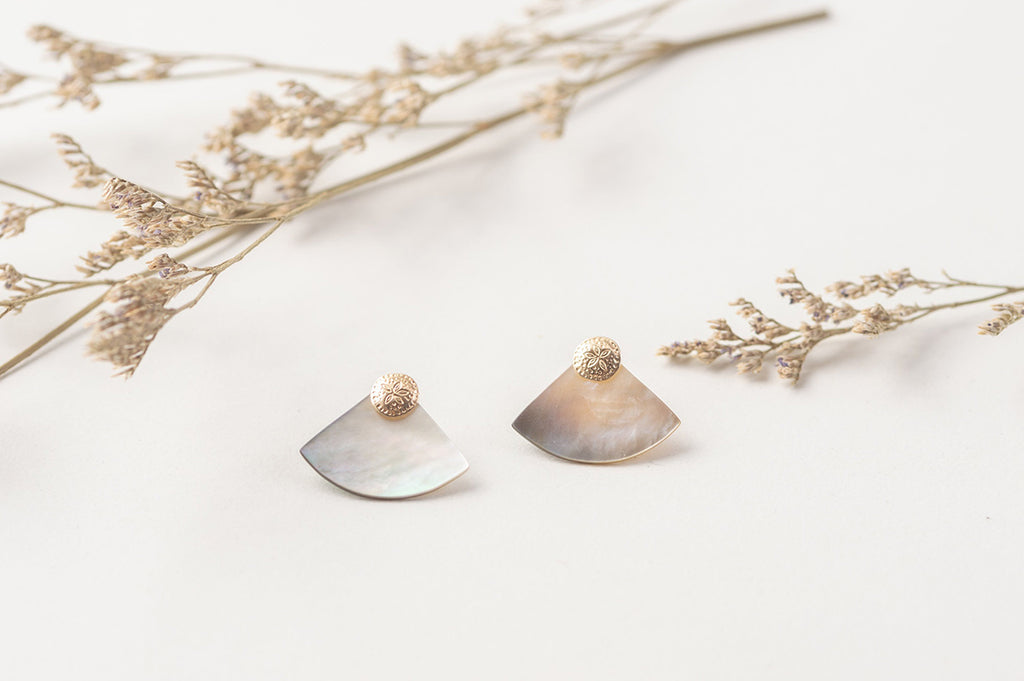 The grey shifting tones of the mother-of-pearl in the Laos stud earrings