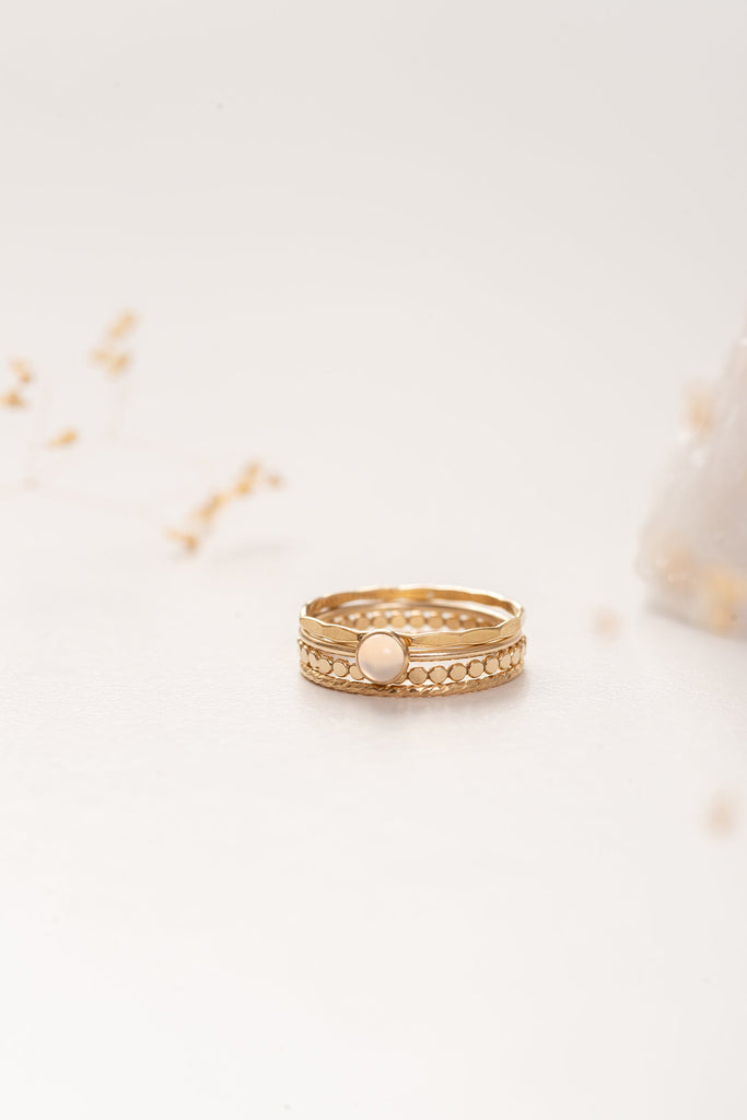 A set of four unique but cohesive gold rings, stacked, by French designer Zoaje