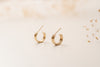 The Rouen hoop earrings by Zoaje, viewed at an angle, and made of three seamed tubes of gold-fill.