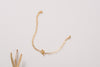 A yellow gold bracelet made with hammered gold chain, with a spring clasp and an OT fastening. 