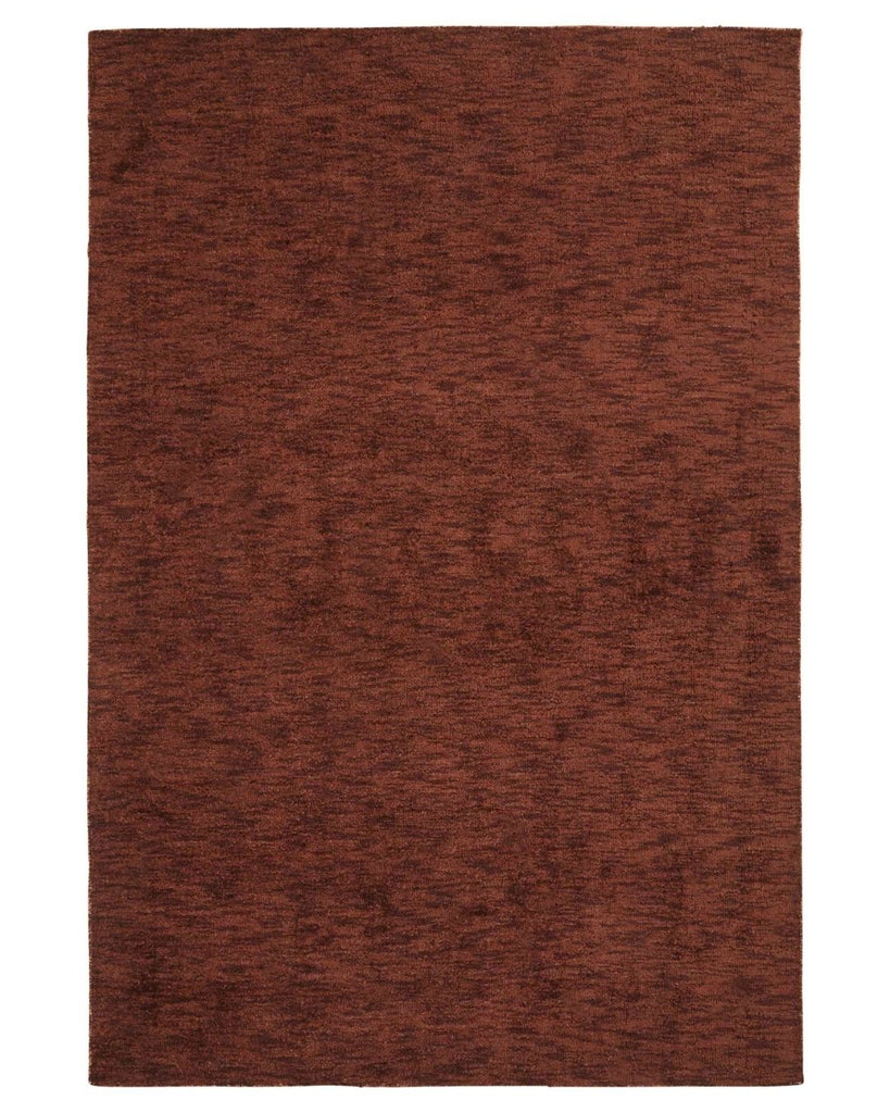 View from above of the Almonte floor rug in a rusty red colour called clay