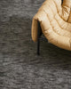 The Almonte floor rug by Weave Home in colour coal, showing black flecked texture