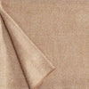 A close up of a luxurious Christian Fischbacher throw, made from soft warm alpaca yarn, and in a classic camel brown