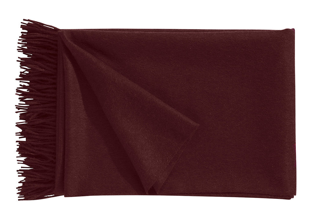 A luxurious Christian Fischbacher throw with fringe detail, made from soft warm alpaca yarn