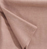 Close up of a luxurious alpaca throw, in muted dusky pink, by Christian Fischbacher