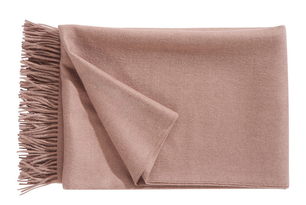 A luxurious Christian Fischbacher throw, made from soft warm alpaca yarn, and in a beautiful muted powder pink colour