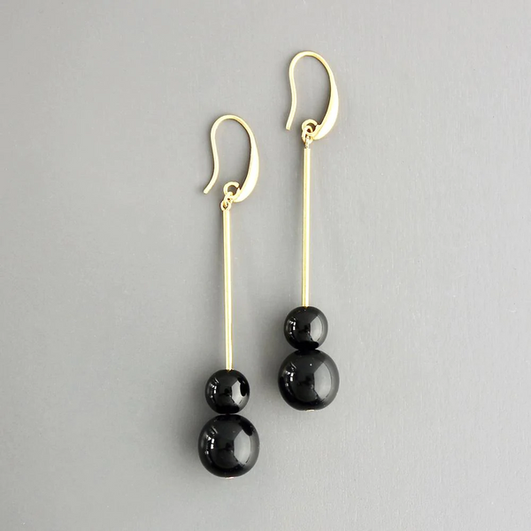Elegantly simple David Aubrey earrigns featuring brass and black beads